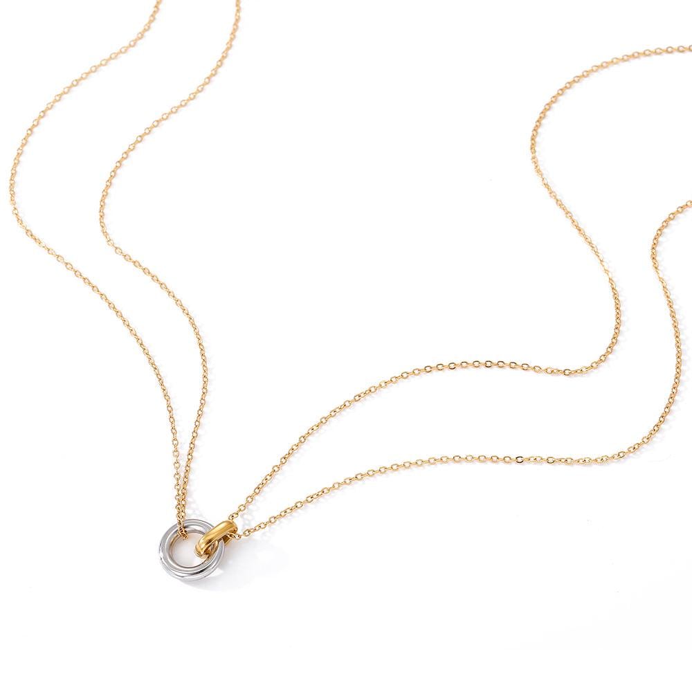 Gold plated chain necklace featuring a dual-tone pendant. The pendant consists of two interlocking circular rings, one in a polished silver tone and the other in a matching gold tone, suspended from the thin metal chain.