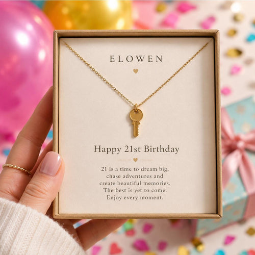 female holding a jewellery box showcasing a 2st birthday engraved key necklace on birthday backing card
