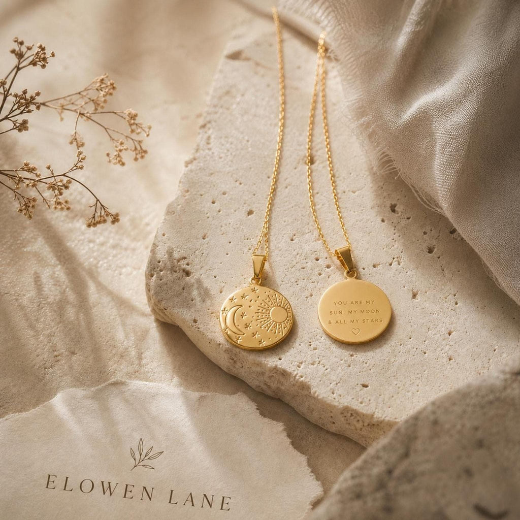 gold plated necklace with circular pendant. features an embossed sun, moon, and star design. The reverse side is engraved with the text: YOU ARE MY SUN, MY MOON & ALL MY STARS, accompanied by a small heart symbol.